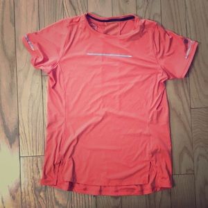 Pink ASICS athletic shirt.
